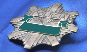 Zdjęcie przedstawia policyjną odznakę, gwiazdę.